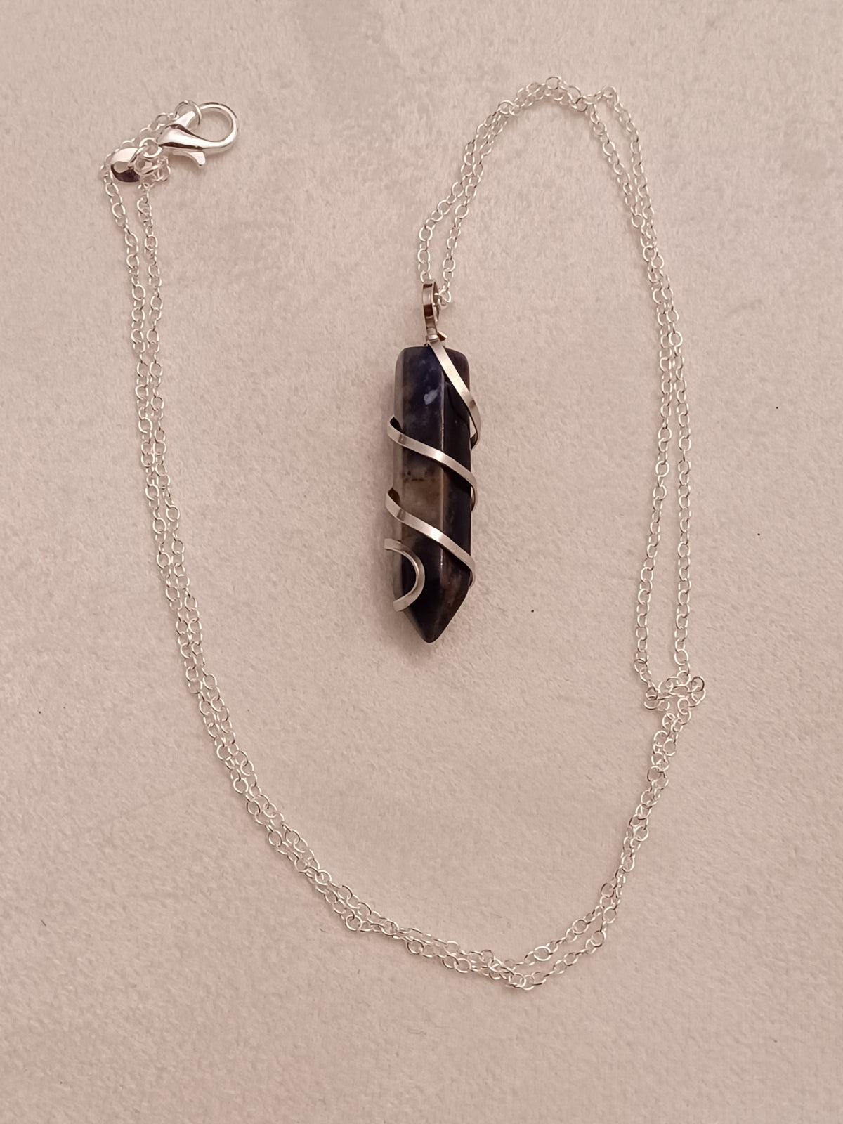 Sunset Sodalite Bullet Silver Wrapped Necklace
